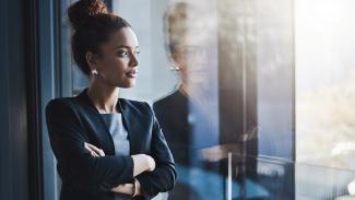 business woman looking outside window